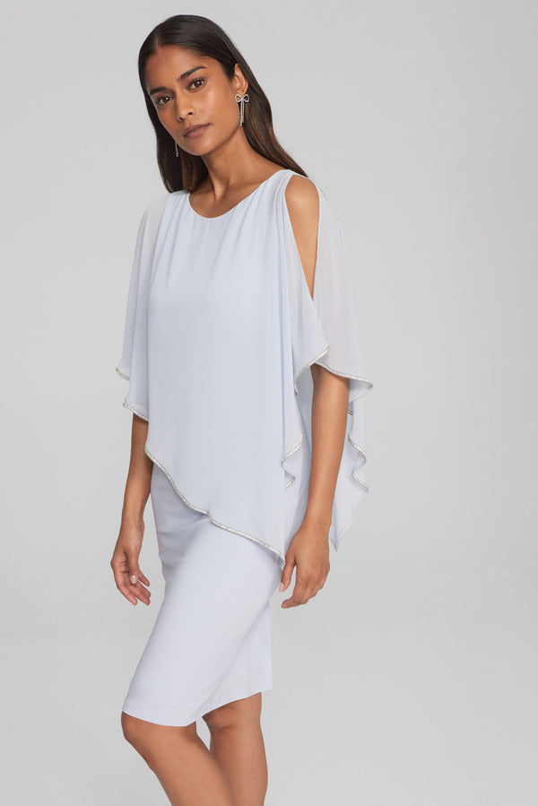 White dress with sales cape overlay